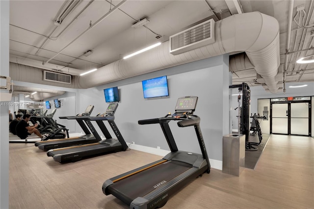 workout area featuring light hardwood / wood-style floors