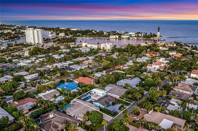 aerial view at dusk with a water view