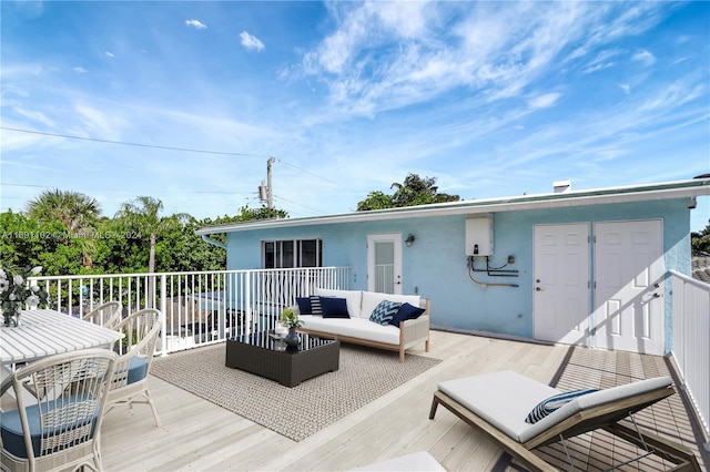 wooden deck with an outdoor hangout area