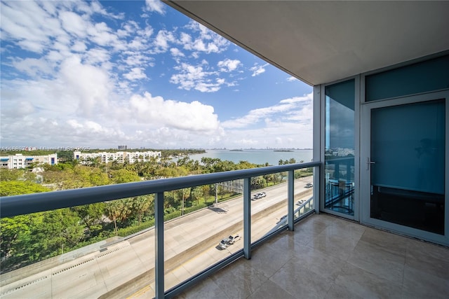 balcony featuring a water view