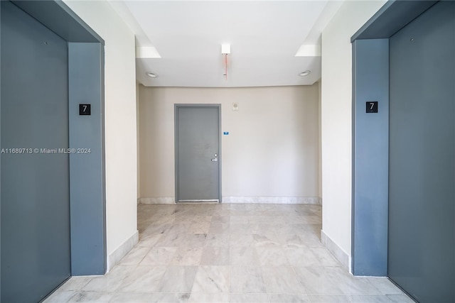 spare room with elevator