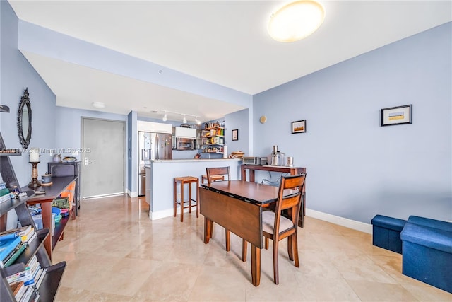 dining space with rail lighting