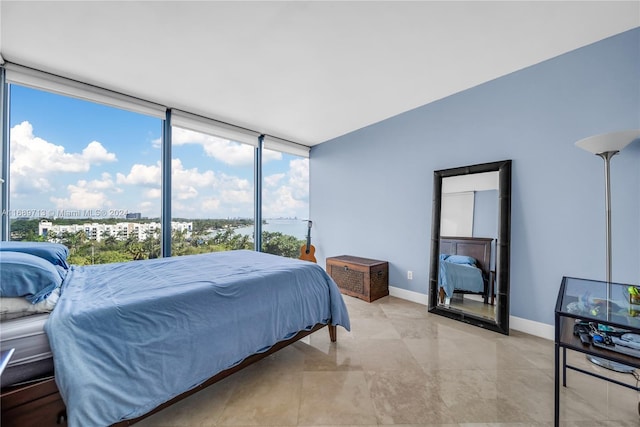 bedroom with a wall of windows