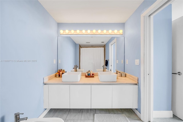 bathroom with a bidet and vanity