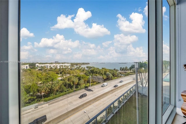 balcony featuring a water view