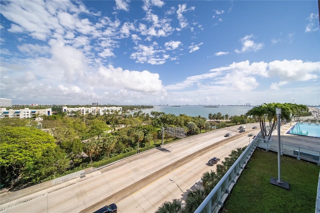 birds eye view of property with a water view