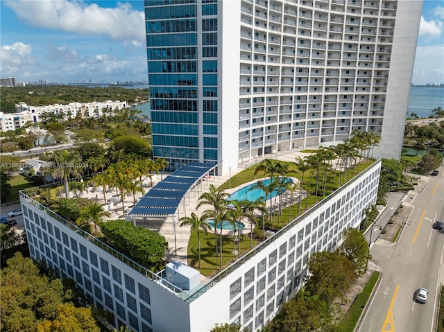 view of building exterior with a community pool