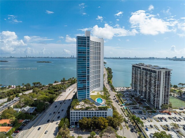 birds eye view of property with a water view