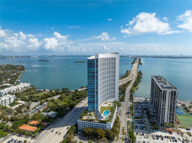 birds eye view of property with a water view