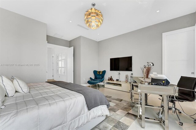 bathroom with vanity, tile patterned floors, and a shower with door