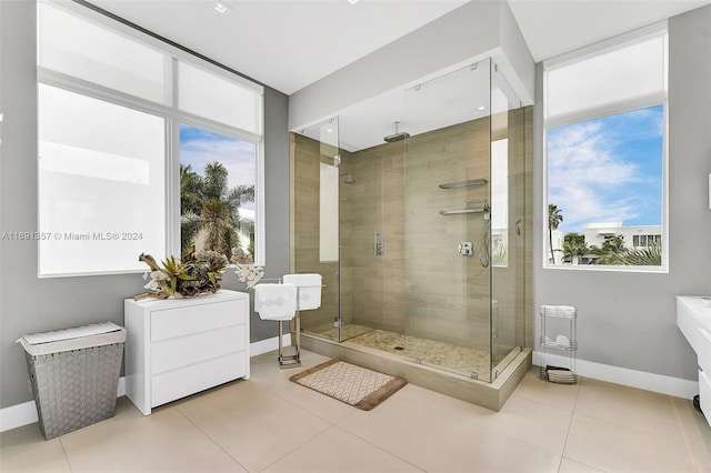 bathroom featuring tile patterned floors and a shower with door