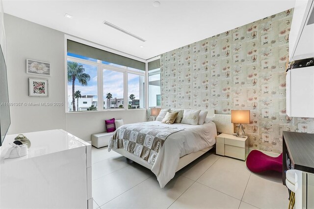 bedroom with light tile patterned floors