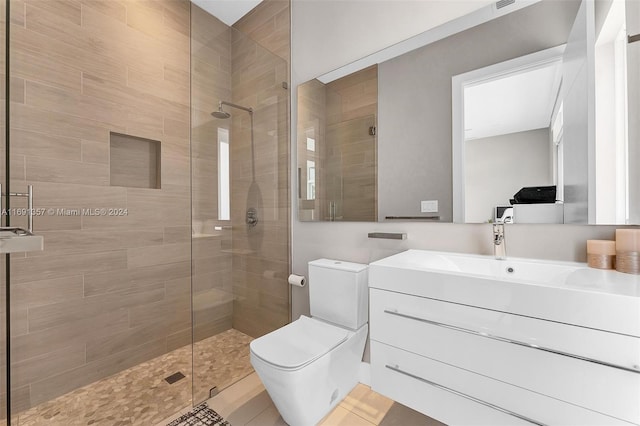 bathroom with walk in shower, tile patterned flooring, vanity, and toilet