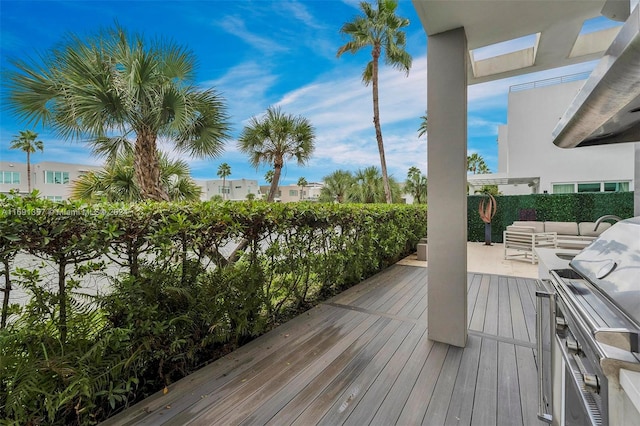 wooden deck with an outdoor hangout area