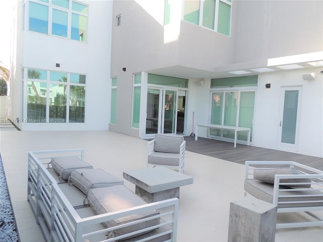 view of patio featuring a wooden deck and an outdoor hangout area