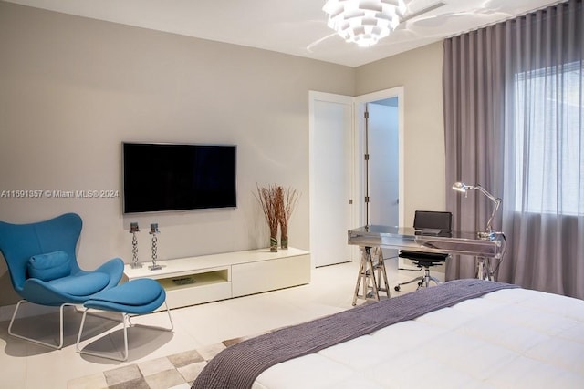 bedroom featuring multiple windows and an inviting chandelier