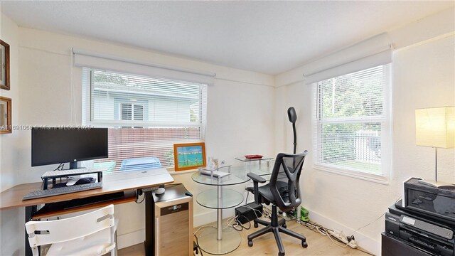 office space with light hardwood / wood-style flooring