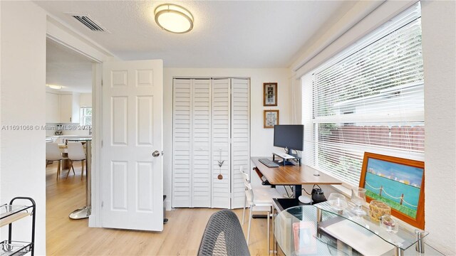 bedroom featuring a closet and light hardwood / wood-style flooring