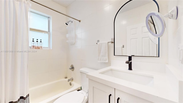 full bathroom featuring shower / tub combo, vanity, and toilet