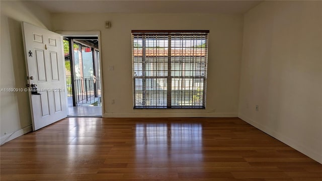 spare room featuring hardwood / wood-style floors