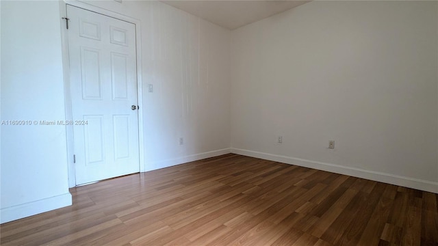 empty room featuring hardwood / wood-style flooring