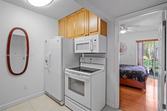 kitchen with light brown cabinetry, white appliances, a textured ceiling, ceiling fan, and light tile patterned flooring