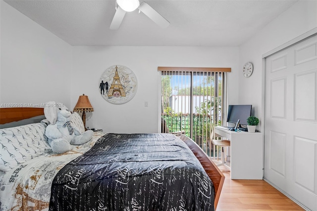 bedroom featuring access to outside, ceiling fan, and light wood-type flooring