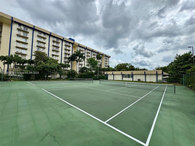 view of sport court with fence