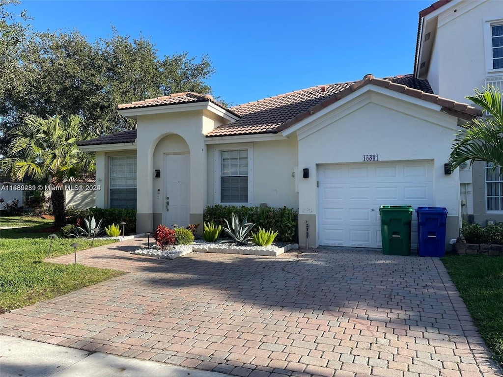 view of front of property with a garage