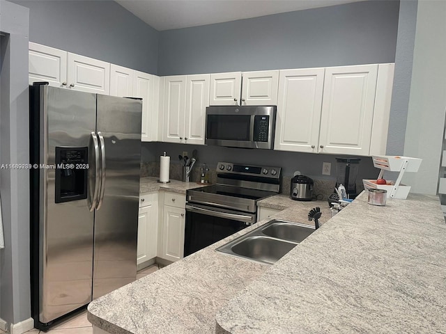 kitchen featuring white cabinetry, stainless steel appliances, and sink