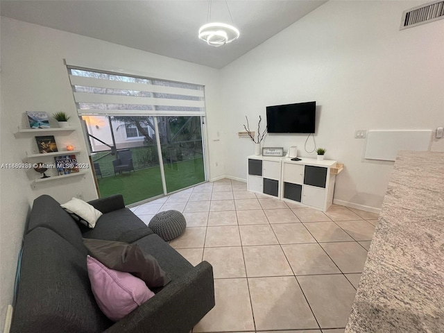 tiled living room with lofted ceiling