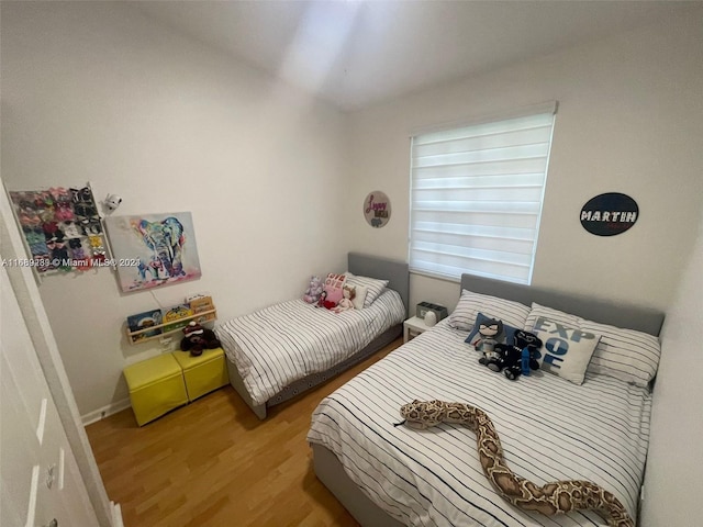 bedroom featuring hardwood / wood-style flooring