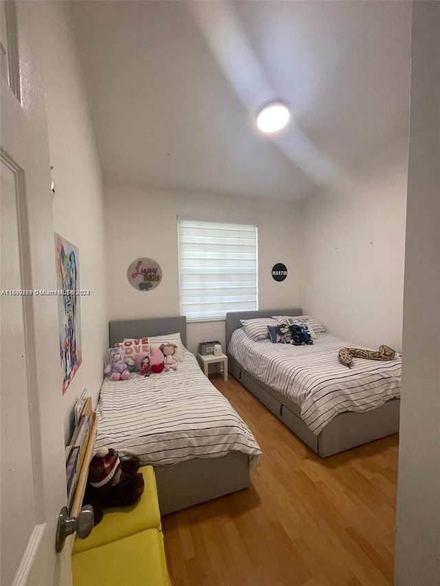 bedroom with hardwood / wood-style floors