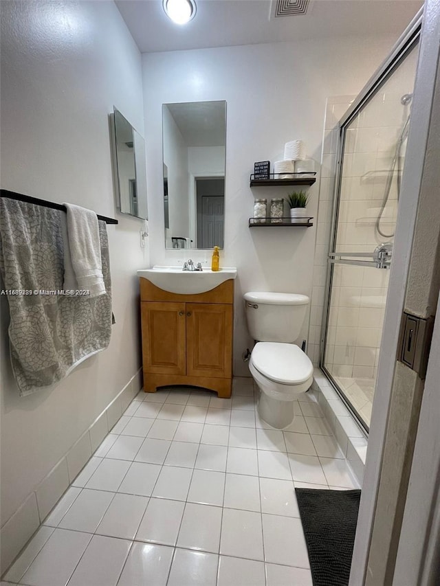 bathroom with walk in shower, tile patterned flooring, vanity, and toilet