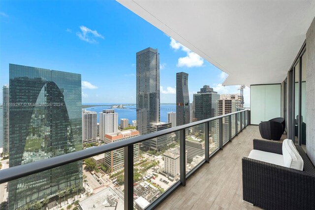 balcony featuring a water view