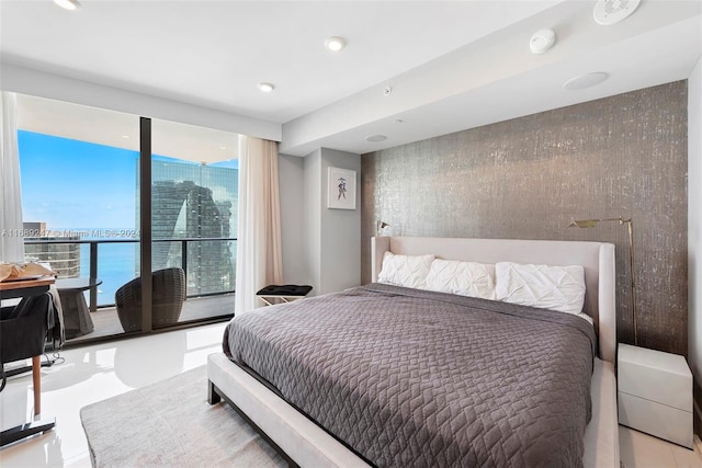 bedroom featuring a water view