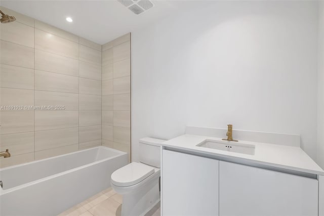 full bathroom featuring tile patterned floors, toilet, vanity, and tiled shower / bath combo