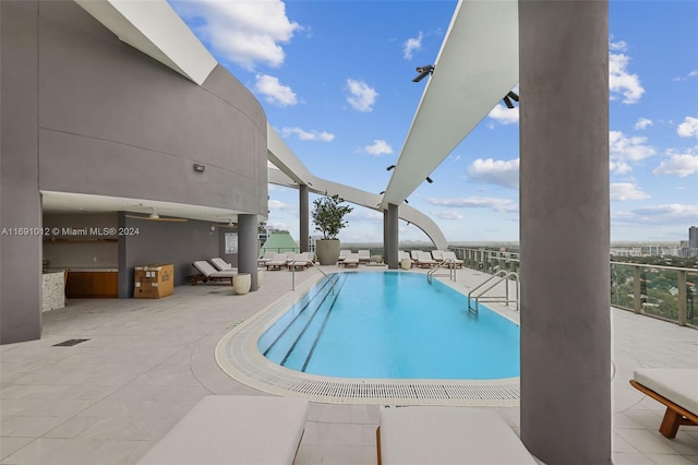 view of swimming pool with a patio area