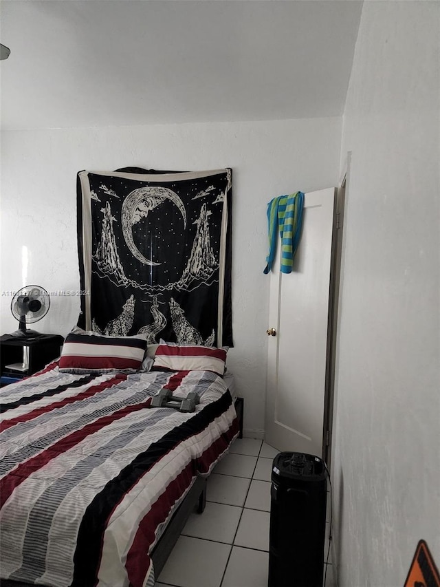 bedroom with light tile patterned floors