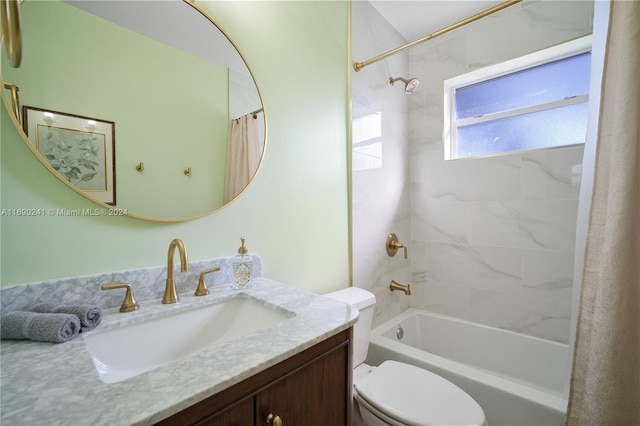 full bathroom featuring vanity, shower / bath combo, and toilet