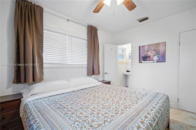 bedroom featuring ensuite bathroom and ceiling fan