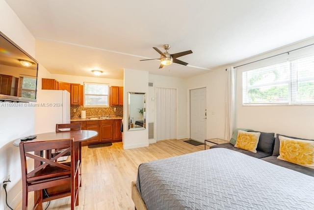 bedroom featuring ceiling fan and light hardwood / wood-style floors