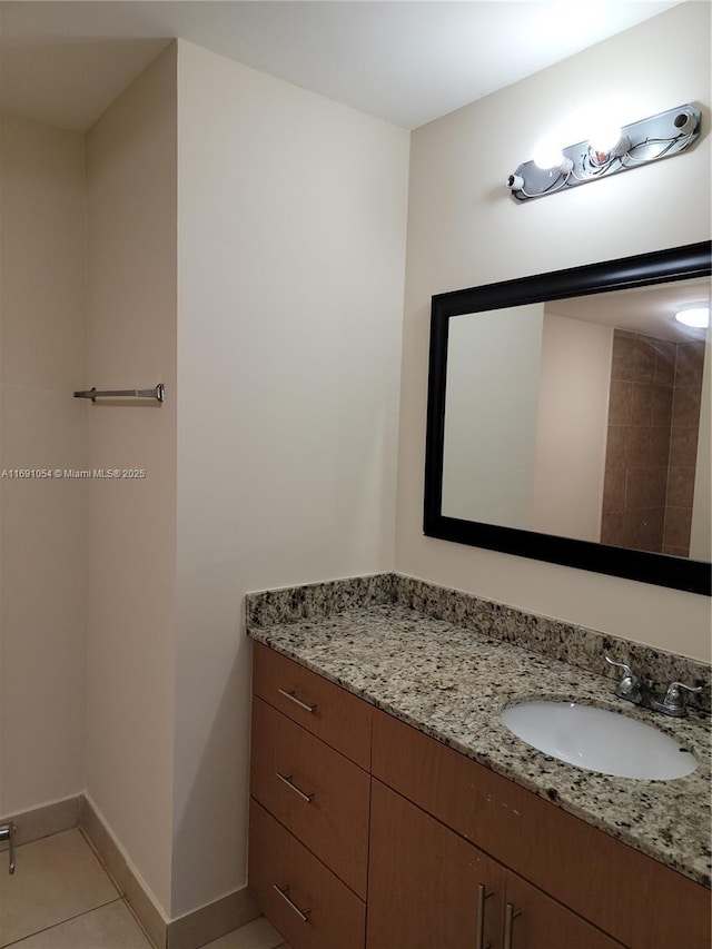 bathroom with vanity and tile patterned floors