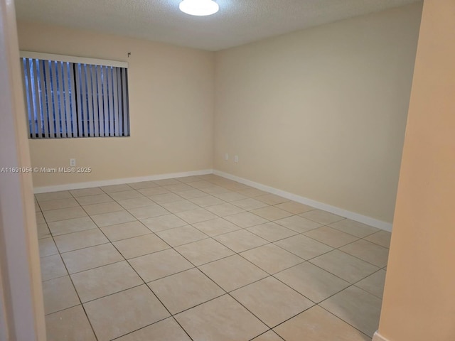 spare room featuring a textured ceiling