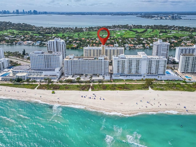 drone / aerial view with a view of the beach and a water view