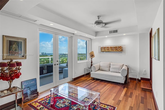 living room with french doors, ceiling fan, and hardwood / wood-style floors