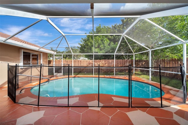 view of pool featuring a lanai and a patio