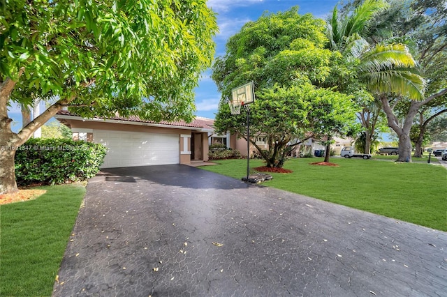 view of front of property with a garage and a front yard