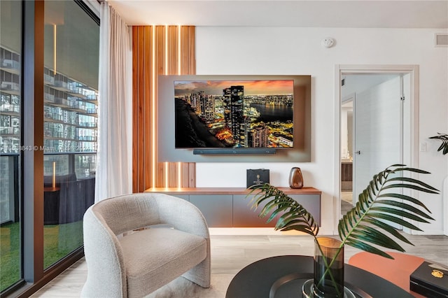 sitting room featuring light hardwood / wood-style floors