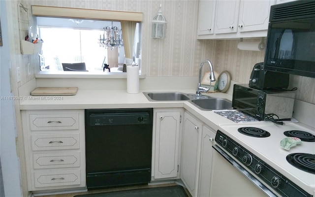 kitchen with white cabinets, black appliances, and sink